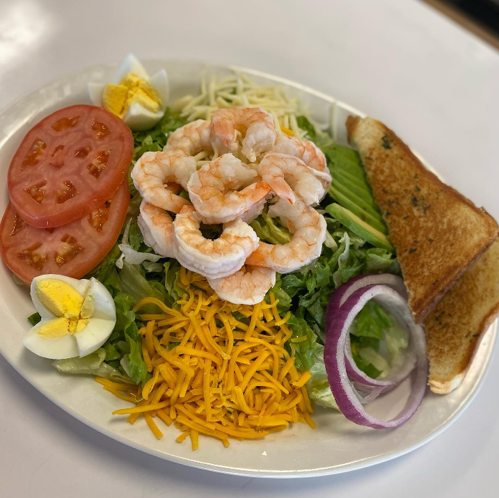 Shrimp Louie salad with avocado, egg and cheddar
